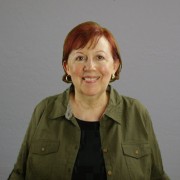 Smiling woman with short red hair